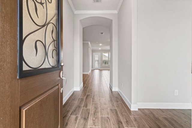 corridor with crown molding and wood-type flooring