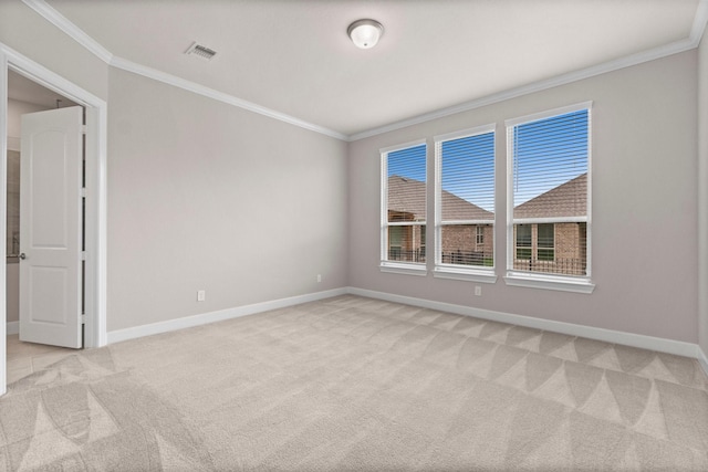 carpeted empty room with crown molding