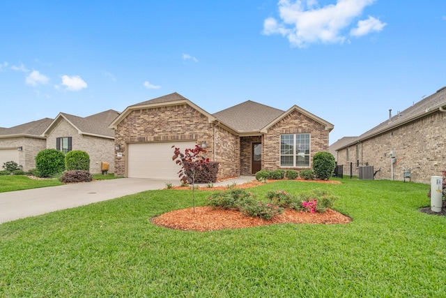 view of front of property with a front yard, a garage, and central AC unit