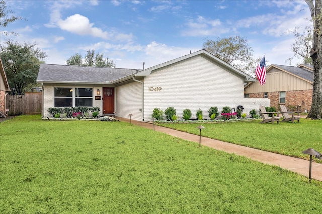 ranch-style house with a front yard