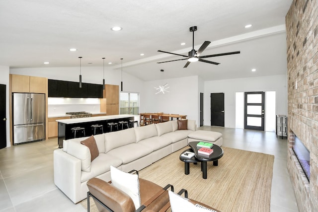 living room featuring vaulted ceiling with beams and ceiling fan