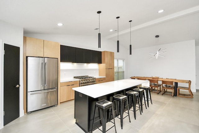 kitchen featuring hanging light fixtures, vaulted ceiling with beams, high quality appliances, a breakfast bar, and a kitchen island