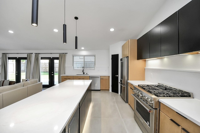 kitchen featuring french doors, stainless steel appliances, sink, wine cooler, and hanging light fixtures