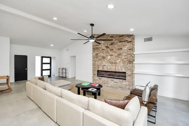 living room featuring ceiling fan, a large fireplace, and lofted ceiling with beams