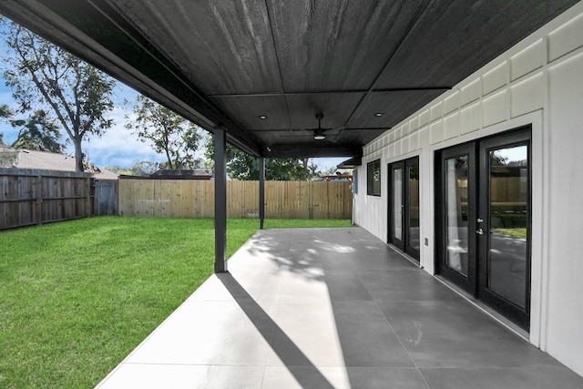 view of patio / terrace featuring ceiling fan and french doors