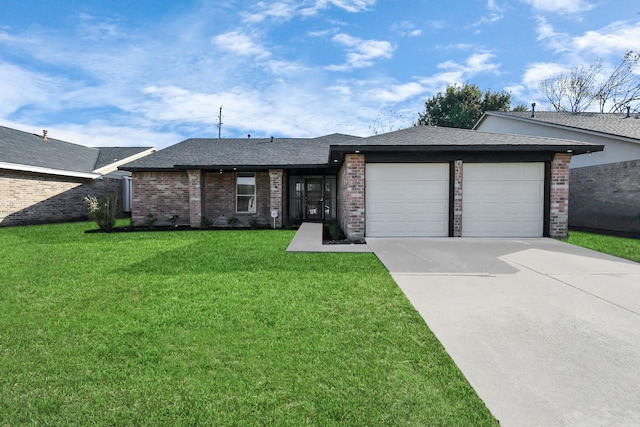 ranch-style house featuring a garage and a front lawn