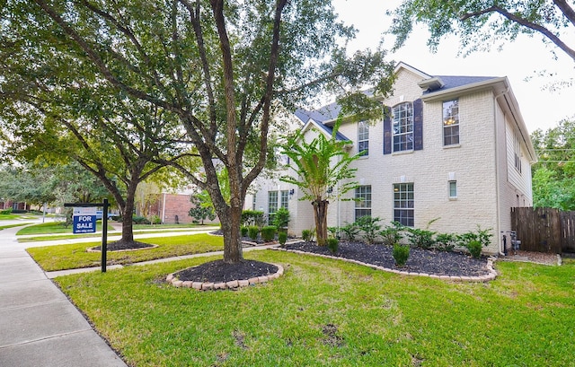 view of front of property with a front lawn