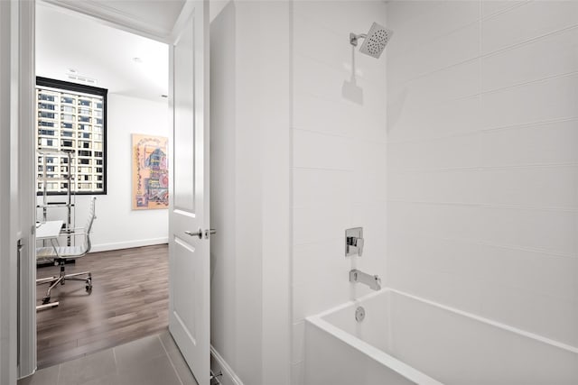 bathroom with tile patterned floors and bathing tub / shower combination