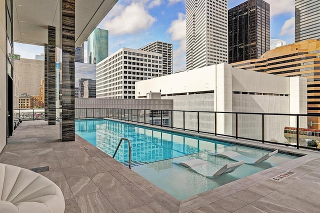 view of swimming pool featuring a patio