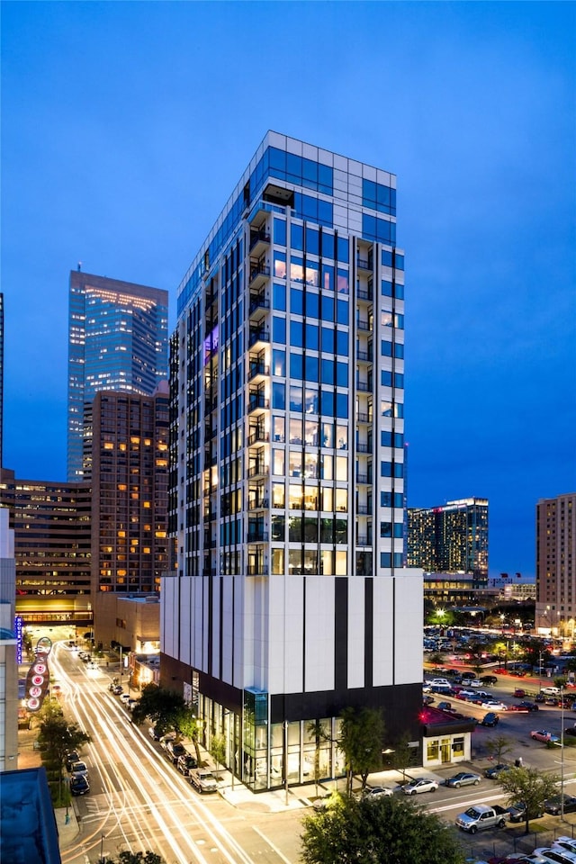 view of outdoor building at dusk