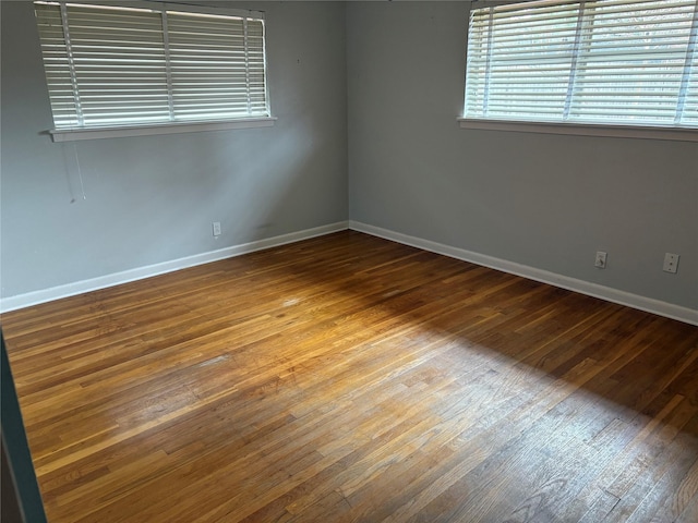 empty room featuring hardwood / wood-style flooring