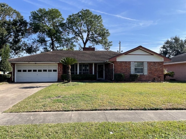 single story home with a front yard and a garage