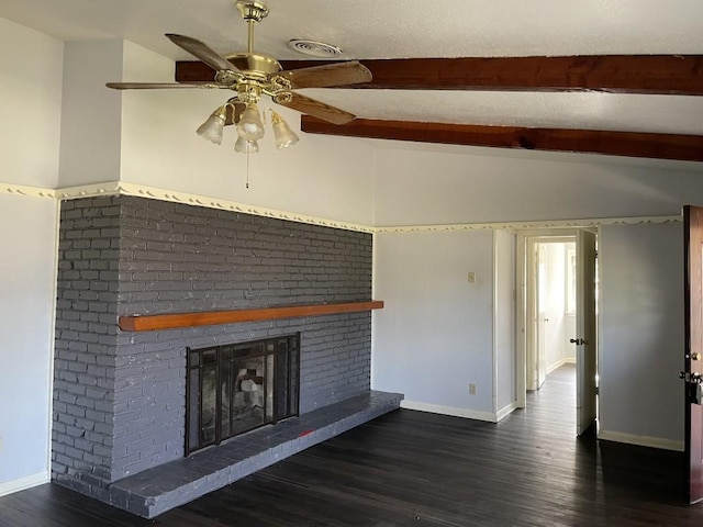 unfurnished living room featuring ceiling fan, lofted ceiling with beams, a fireplace, and dark wood-type flooring