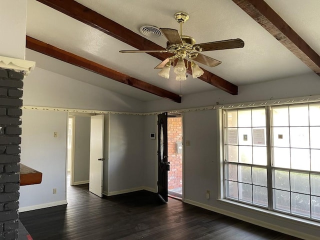 empty room with dark hardwood / wood-style floors, a wealth of natural light, and ceiling fan