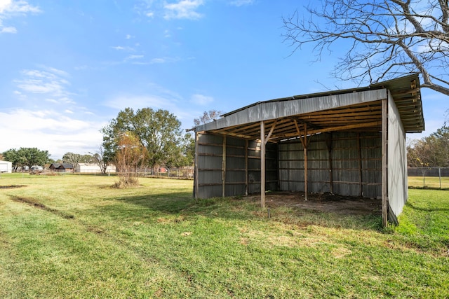 view of outbuilding featuring a yard