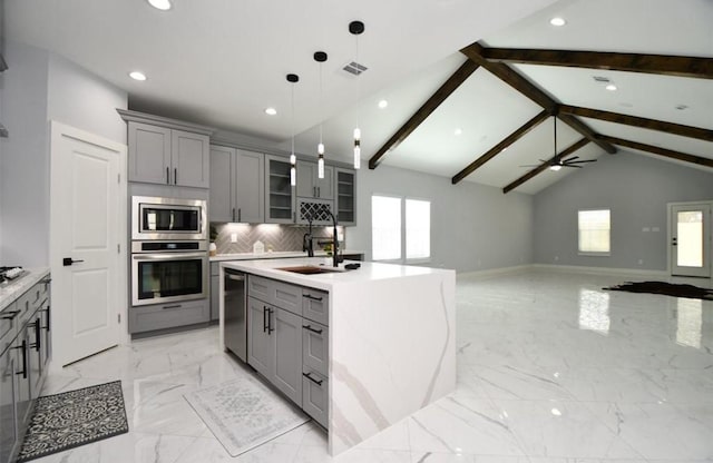 kitchen featuring decorative backsplash, stainless steel appliances, ceiling fan, vaulted ceiling with beams, and gray cabinets