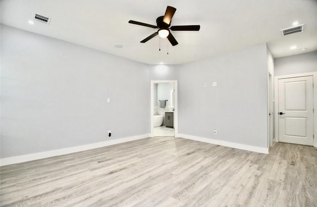 empty room featuring ceiling fan and light wood-type flooring