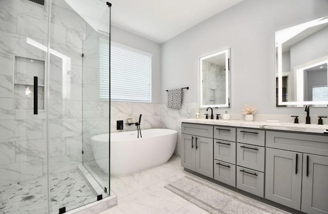 bathroom with vanity, separate shower and tub, and tile walls