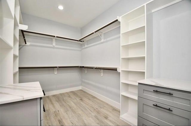 walk in closet featuring light wood-type flooring