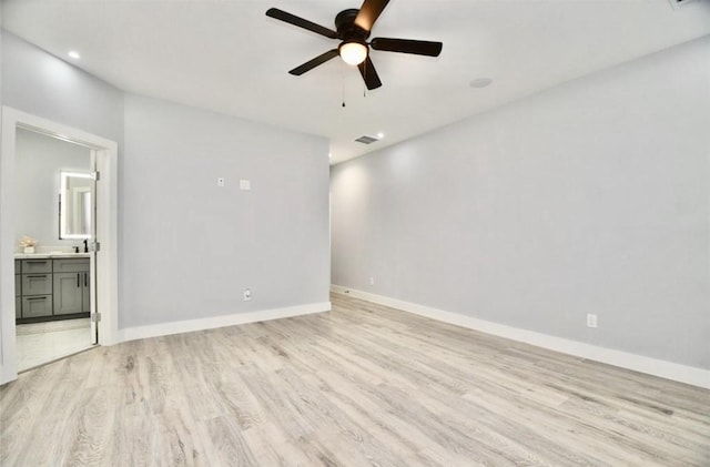 unfurnished room featuring ceiling fan and light hardwood / wood-style flooring