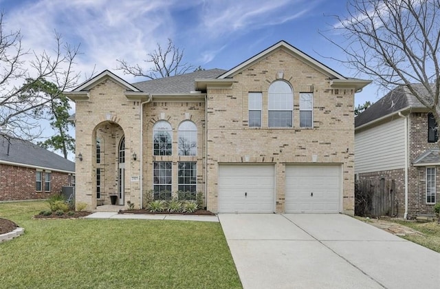 view of front of property featuring a front yard and a garage