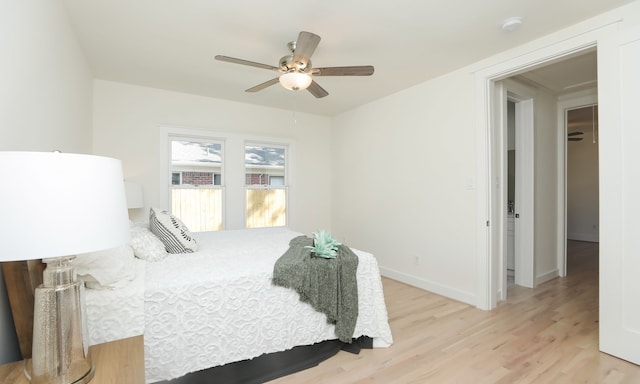 bedroom featuring ceiling fan and light wood-type flooring