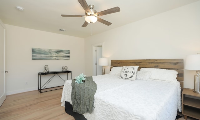 bedroom with light wood-type flooring and ceiling fan