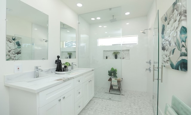 bathroom with vanity and walk in shower