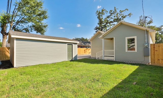 back of house with a yard