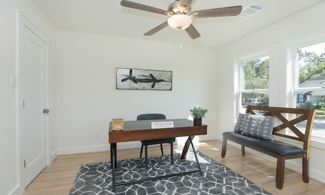 office space with ceiling fan and light hardwood / wood-style flooring