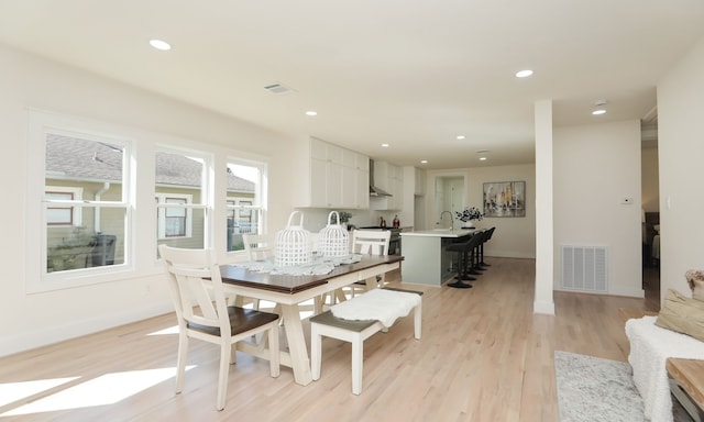 dining area with light wood-type flooring