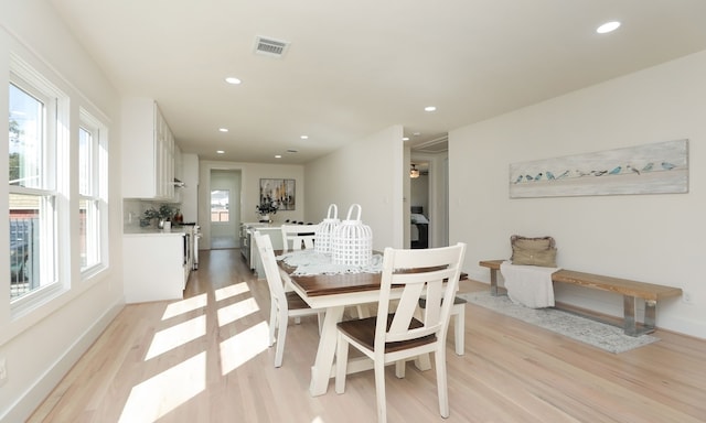 dining space featuring a healthy amount of sunlight and light wood-type flooring