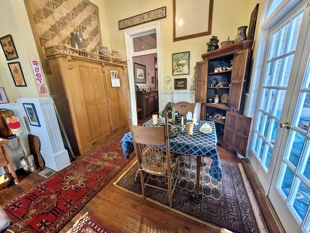 dining area featuring french doors and dark hardwood / wood-style floors