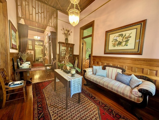 sitting room featuring hardwood / wood-style flooring and a chandelier