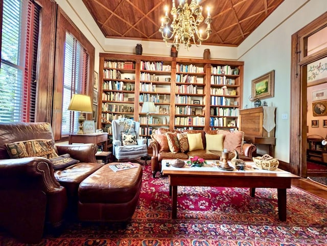 living area with wood ceiling and a notable chandelier