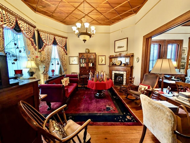 interior space featuring wood-type flooring, wood ceiling, and an inviting chandelier