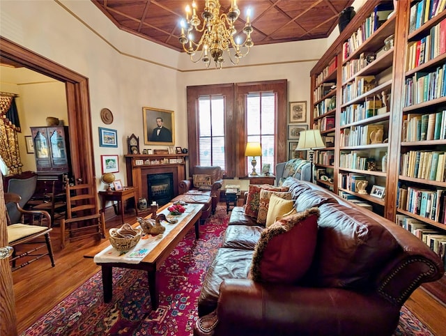 living room with a chandelier and wood-type flooring