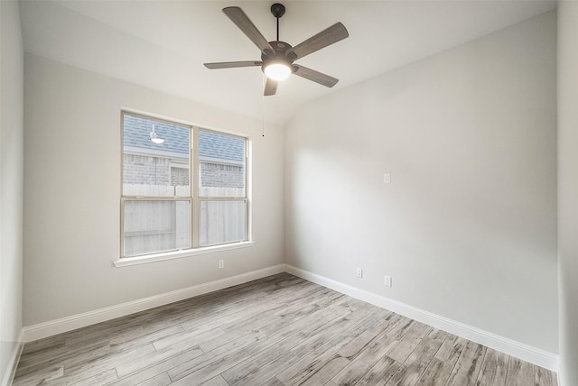 spare room with ceiling fan and light wood-type flooring