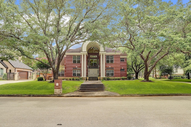 neoclassical home with a front lawn