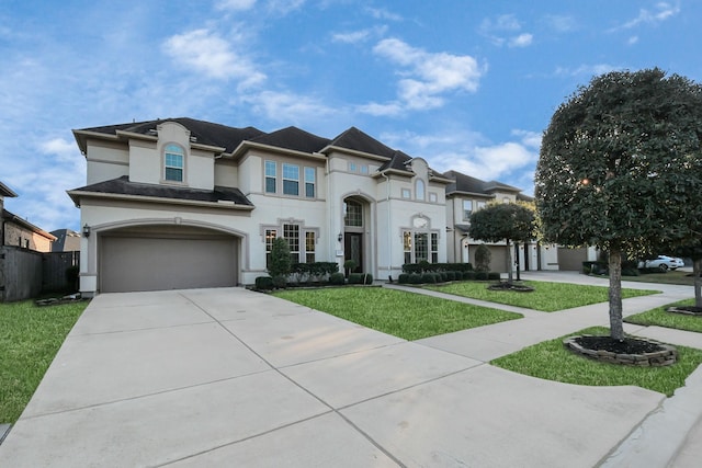 view of front facade featuring a garage and a front lawn