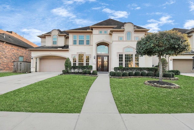 view of front of home featuring a garage and a front lawn