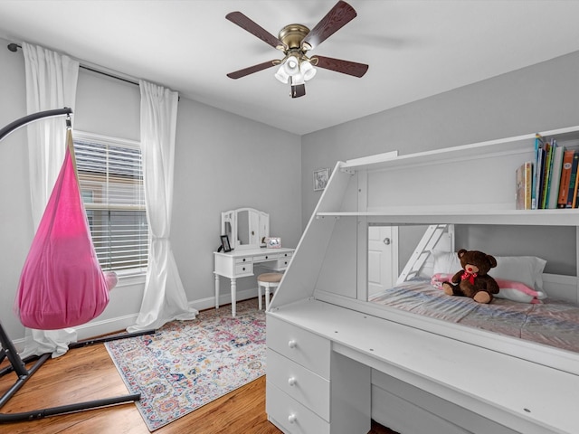 bedroom featuring ceiling fan and hardwood / wood-style floors