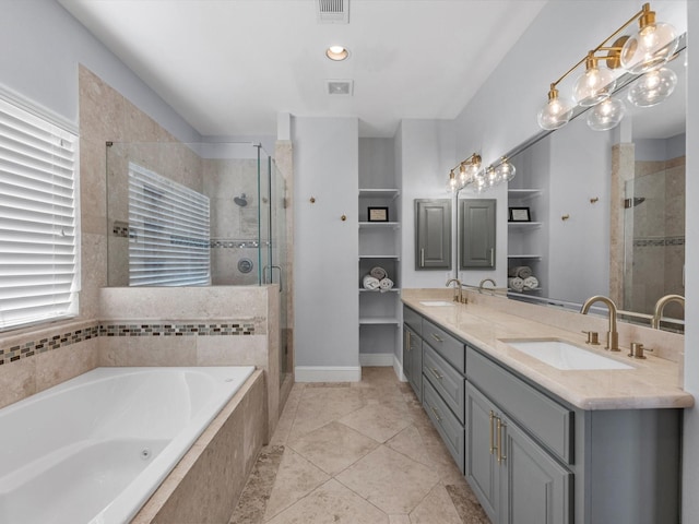 bathroom featuring tile patterned floors, vanity, and separate shower and tub