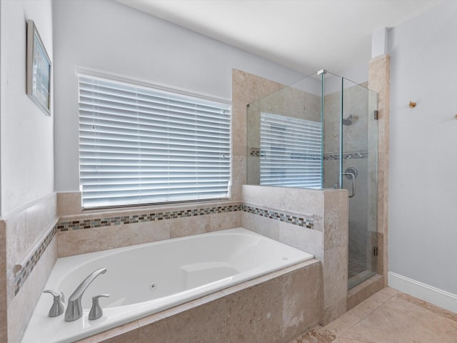 bathroom featuring tile patterned floors and shower with separate bathtub