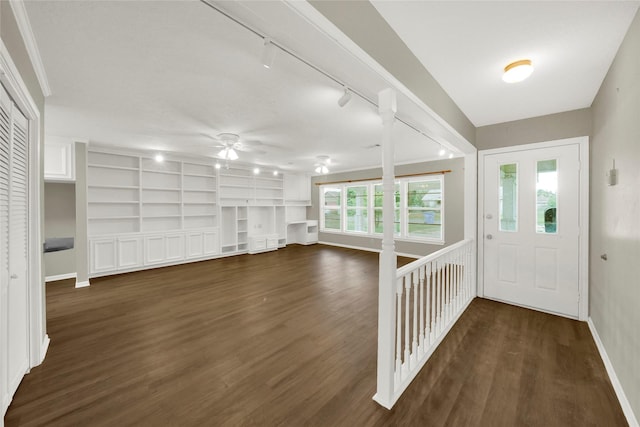 entryway with dark hardwood / wood-style flooring, rail lighting, ceiling fan, and a healthy amount of sunlight