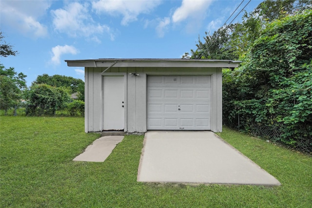 garage featuring a yard