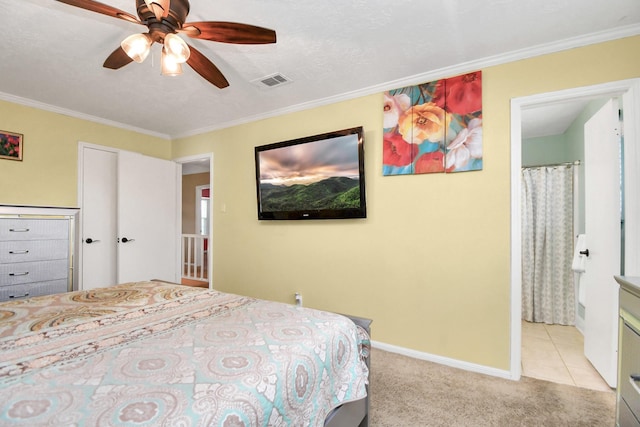 bedroom featuring ceiling fan, light colored carpet, and ornamental molding