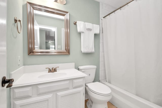 full bathroom with vanity, toilet, and shower / tub combo with curtain