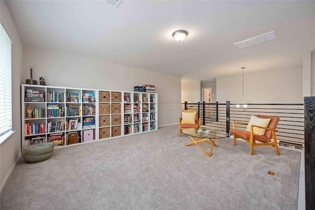 sitting room featuring carpet flooring