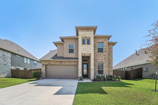 view of front of house featuring a front yard and a garage